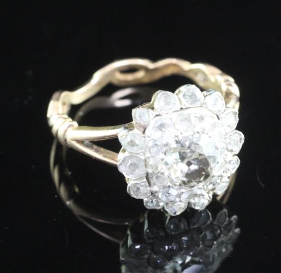 A 19th century gold, silver and diamond cluster ring, size K.